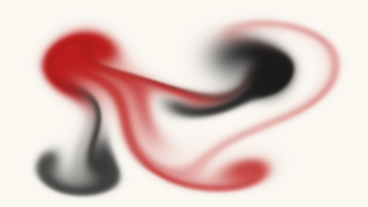 Crimson and black ink tracing the motion of a simulated fluid.